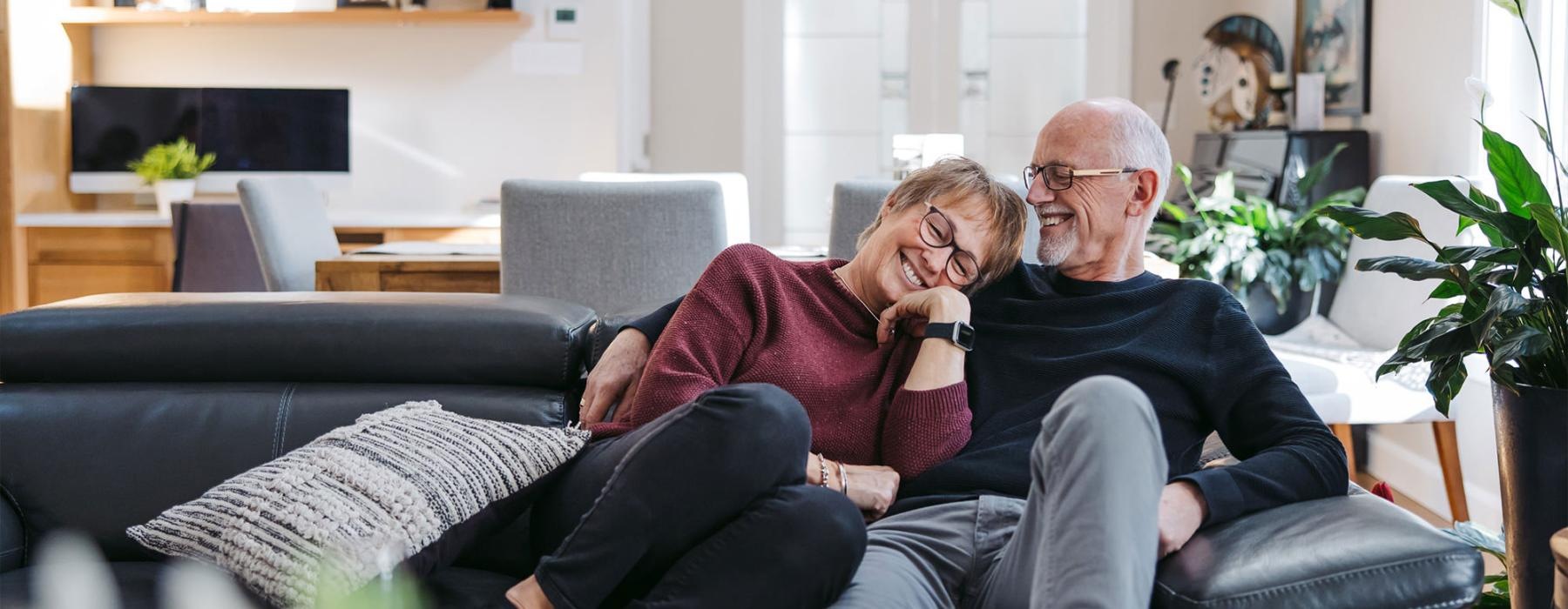 a man and woman sitting on a couch